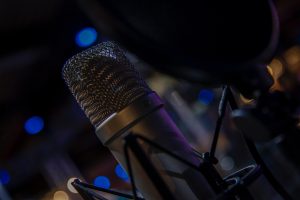 Jodi Krangle Voice Actor A condenser microphone
